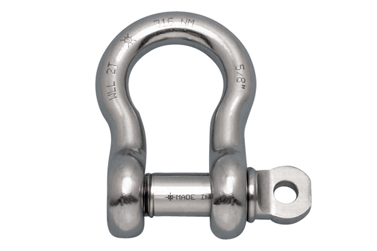 Shackle helical anchors secure guy wires for tall structures